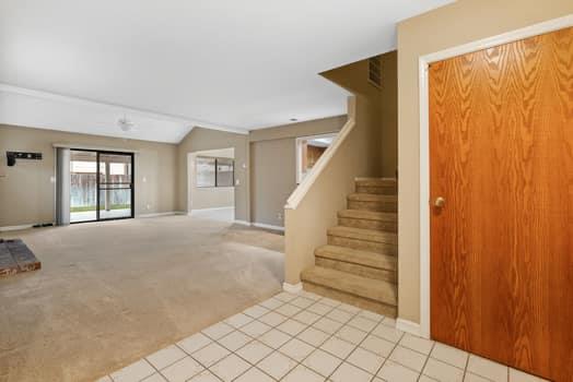 913 Valley Way Madera, CA 93637 - Photo 6 of 39 a view of an empty room with wooden floor and windows