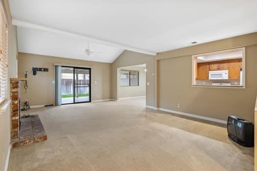 913 Valley Way Madera, CA 93637 - Photo 7 of 39 a view of an empty room with window