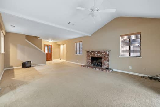 913 Valley Way Madera, CA 93637 - Photo 10 of 39 a view of a livingroom with furniture and a fireplace