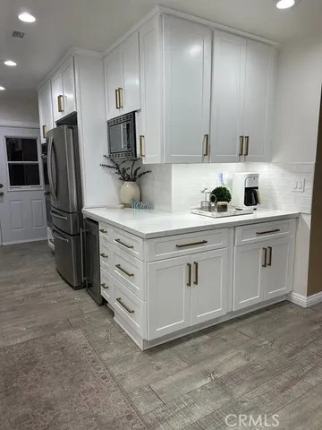 a close view of potted and white cabinets