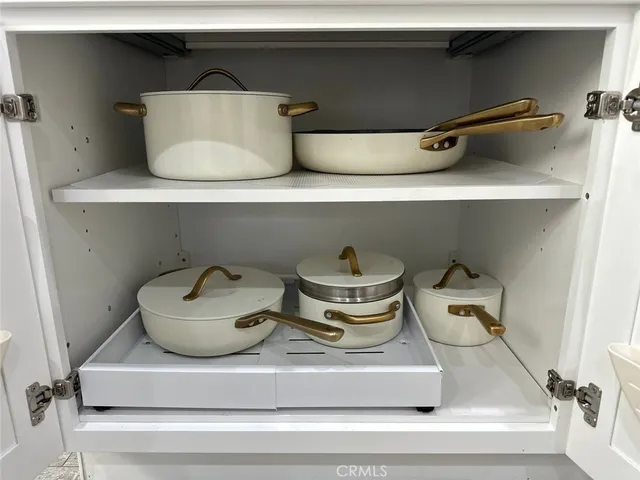 a balcony with table and chairs
