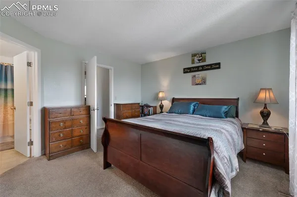 a bedroom with a bed and a cabinets