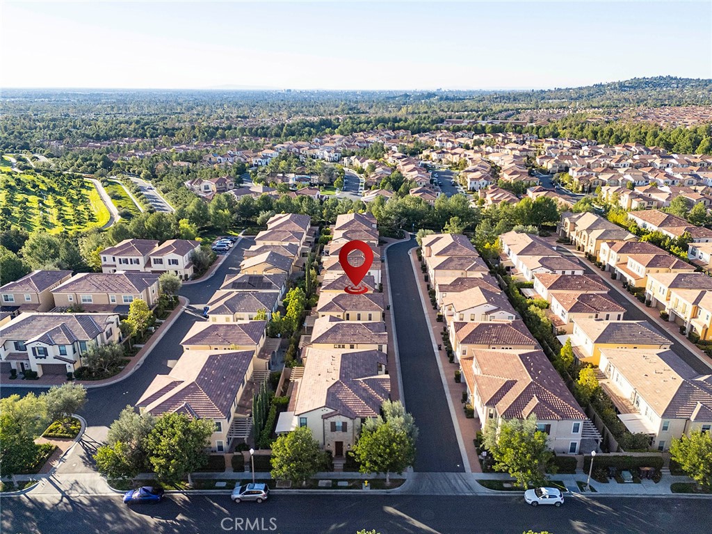143 Rodeo Irvine, CA 92602 - Photo 34 of 37 an aerial view of residential houses with outdoor space and parking