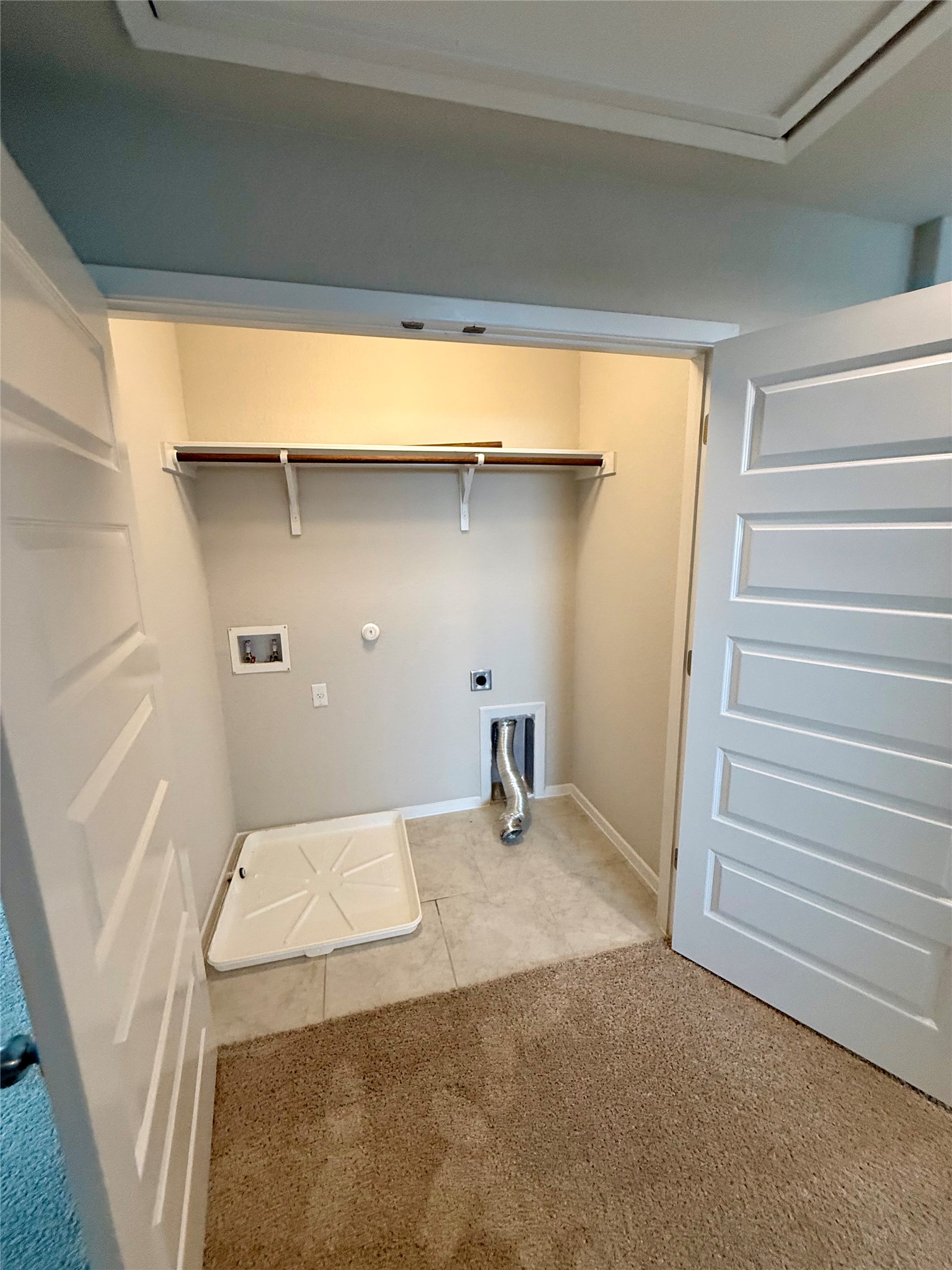 212 Lake Placid Run Elgin, TX 78621 - Photo 12 of 27 A dedicated laundry space provides practical amenities for household chores.