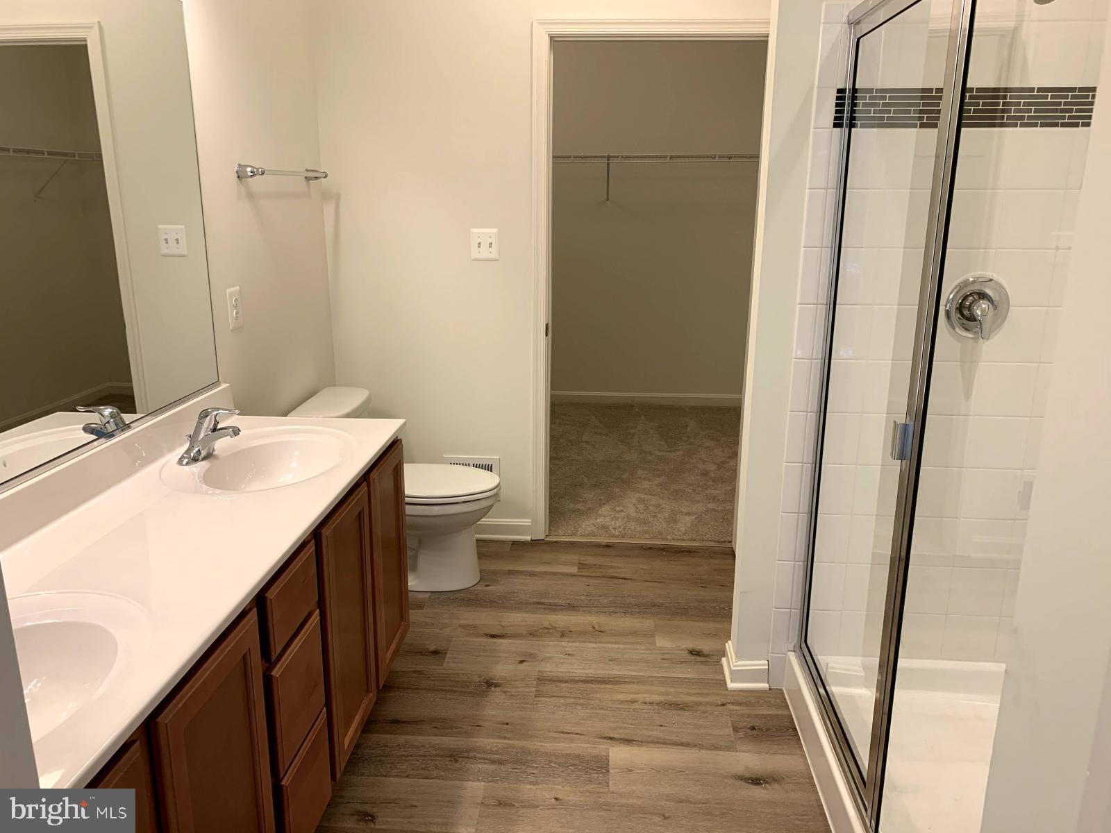 263 Trails Way Joppa, MD 21085 - Photo 10 of 27 a bathroom with a sink a toilet a mirror and shower