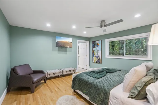 a bedroom with two beds and a large window