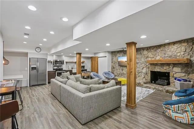 a living room with furniture and a fireplace
