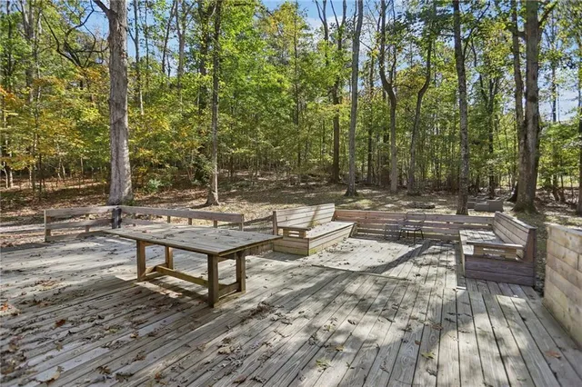 a view of a backyard with sitting area