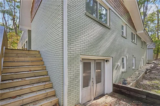 a view of a house with a door side view of a house