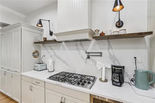 a kitchen with a sink and cabinets