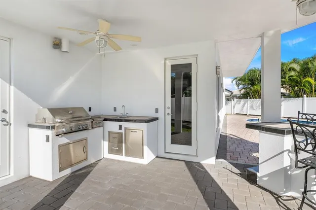 a large kitchen with a table and chairs in it