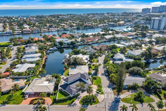 an aerial view of residential houses with outdoor space