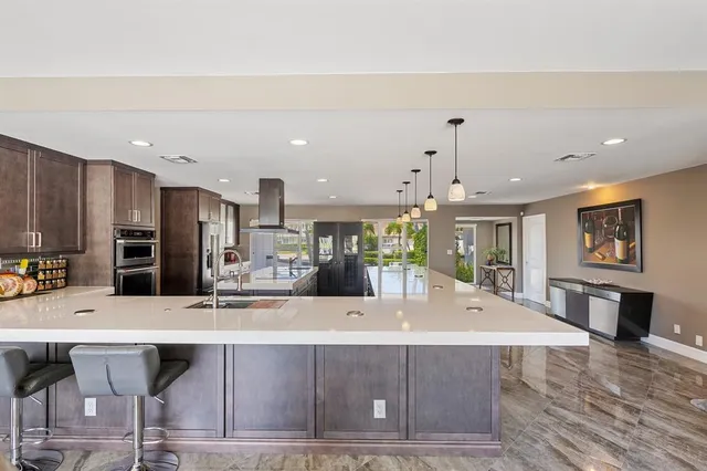 a room with lots of furniture and a large window