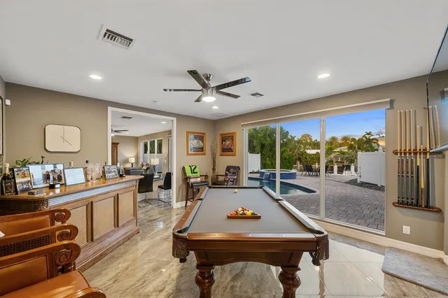 a dining room with furniture a window and appliances