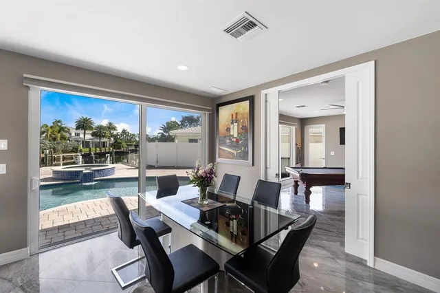 a kitchen with a table and chairs in it