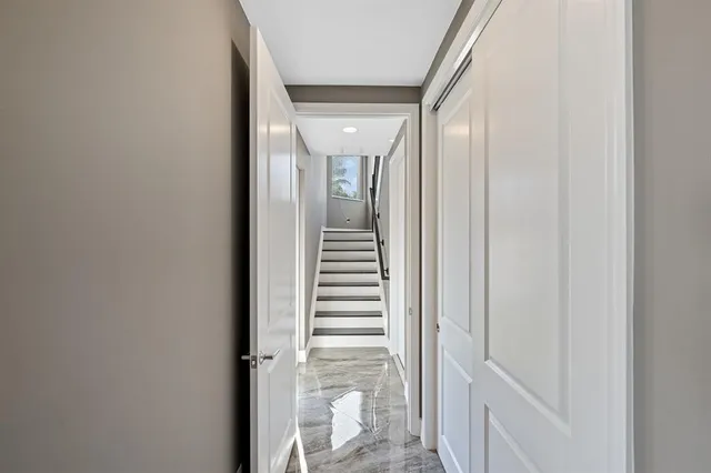 a large bathroom with a sink and mirror