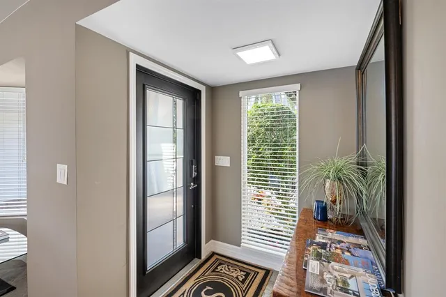 a large bathroom with a tub sink and mirror