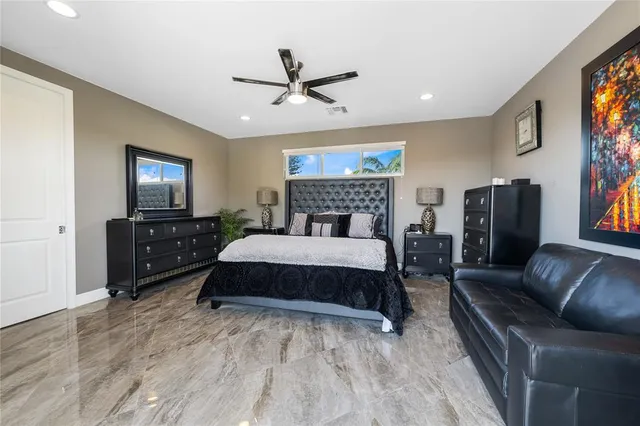 a view of walk in closet with clothes