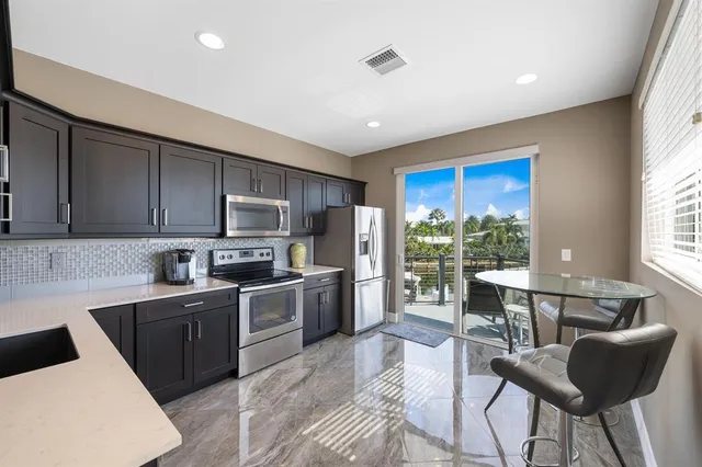 a bathroom with a shower and a sink