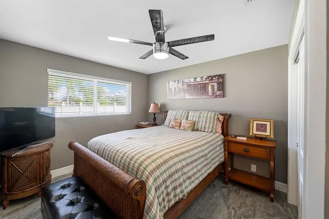 a picture of a bench in front of a wall