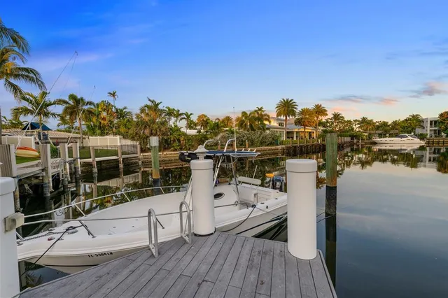 a view of a lake with a house in the background