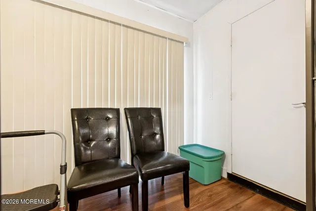 a view of a livingroom with furniture and a window