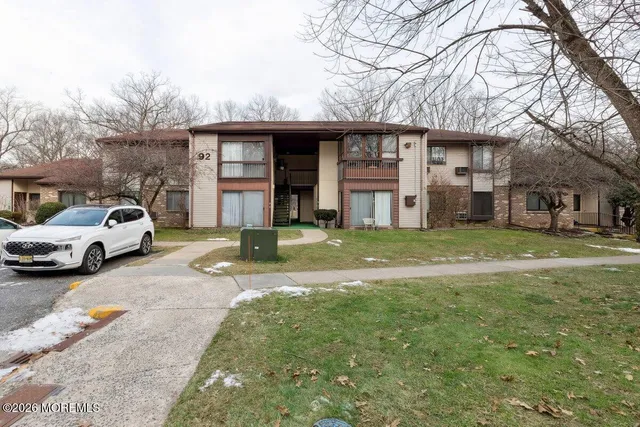 a view of a car park in front of house