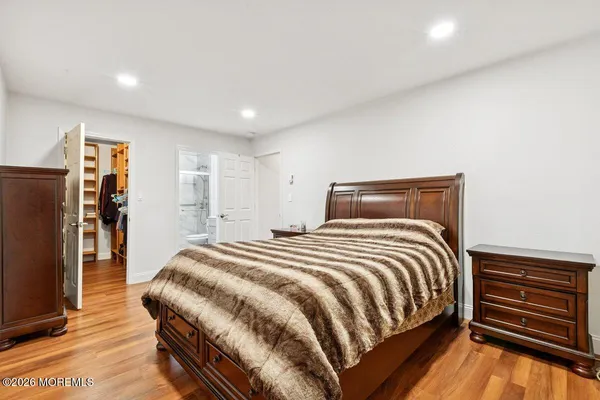 a bedroom with a bed and a closet
