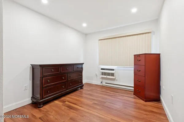 a room with furniture and wooden floor