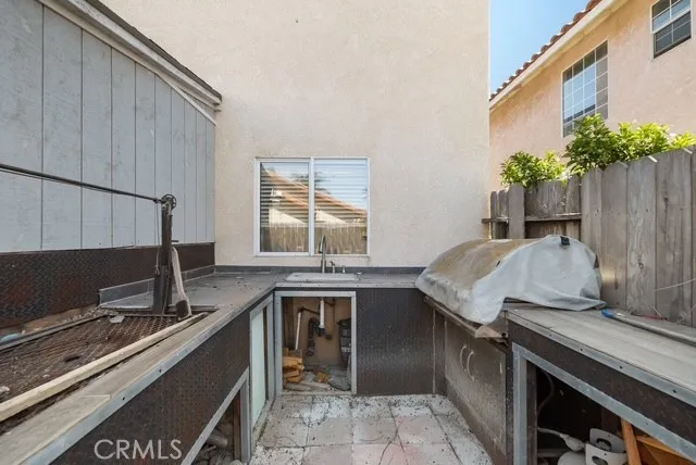 a table and chairs in front of a house