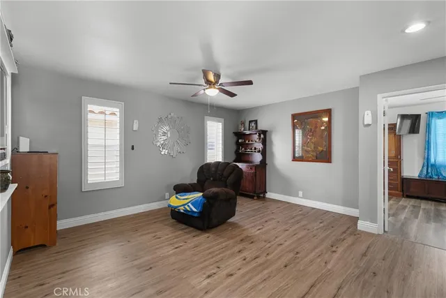 a view of a dining room with furniture and window