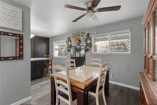 a view of a dining room with furniture wooden floor and chandelier