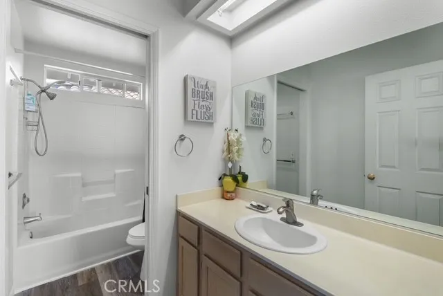 a bedroom with bed and a window