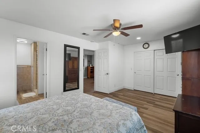 a kitchen with a table chairs and cabinets