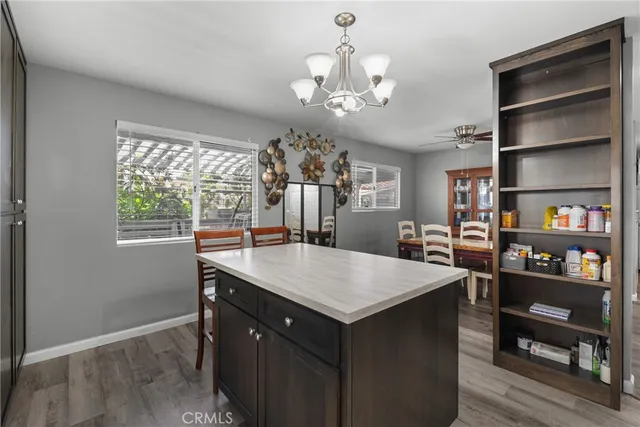 a kitchen with stainless steel appliances granite countertop a sink stove and microwave