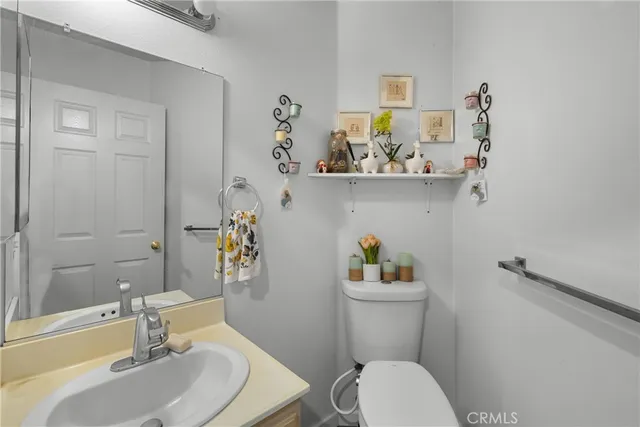 a bedroom with a large bed and windows