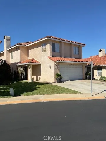 a front view of a house with a garage