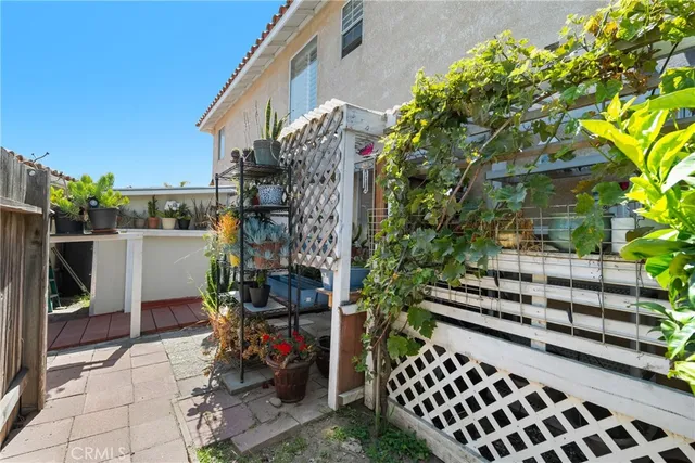 a view of a chairs and table in a patio