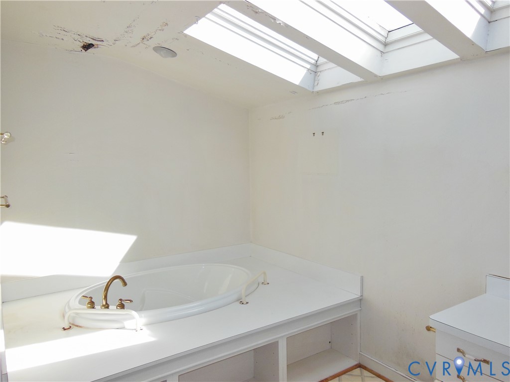 8218 Overbury Road Richmond, VA 23227 - Photo 17 of 37 a bathroom with a sink and a vanity