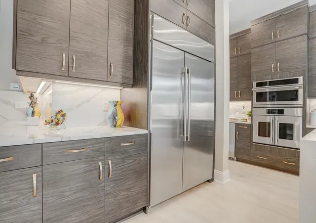 a dining room with furniture and a potted plant
