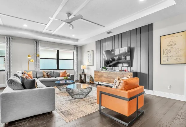 a bedroom with a large bed and a potted plant