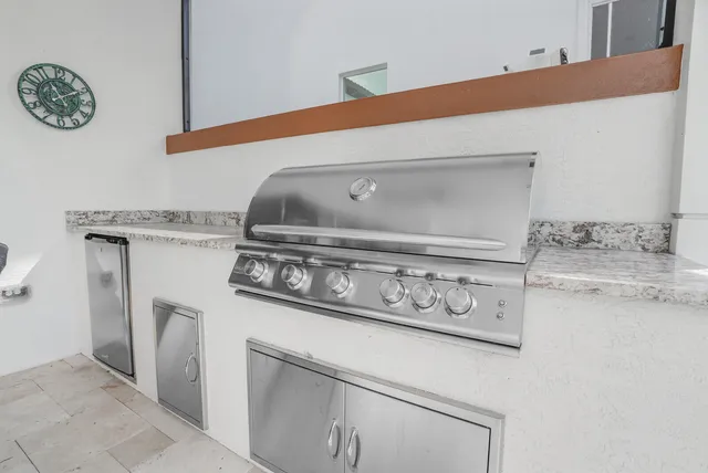 a view of a swimming pool with outdoor seating