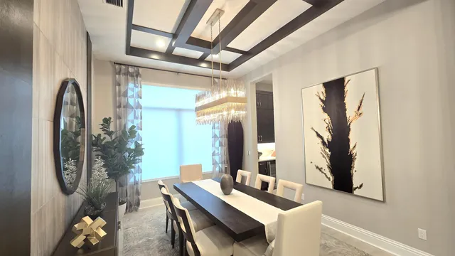 a living room with furniture a flat screen tv and a large window