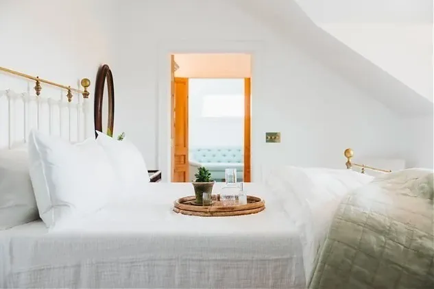 a living room with couch and window