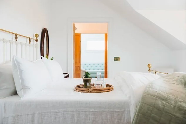 3 Wauwinet Road Nantucket, MA 02554 - Photo 12 of 32 a living room with couch and window