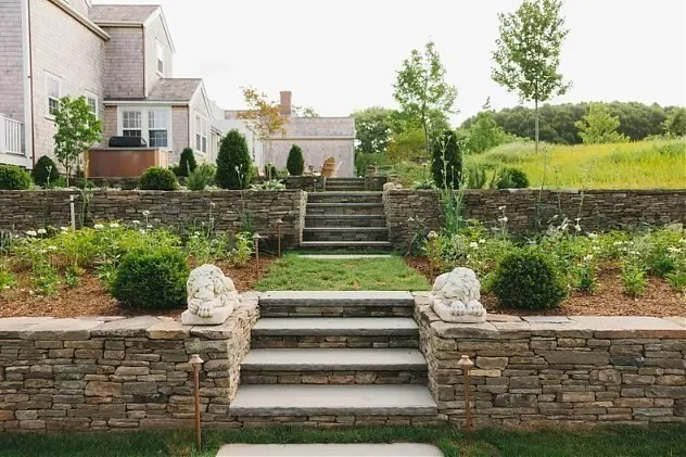 a view of a garden with lawn chairs