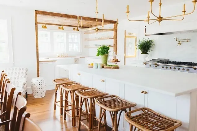 a kitchen with a table chairs and a window