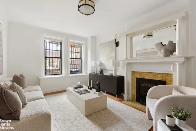 a living room with furniture a window and a dining table