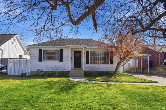 357 100 East Bountiful, UT 84010 - Photo 1 of 1 View of front of house featuring a carport and a shingled roof