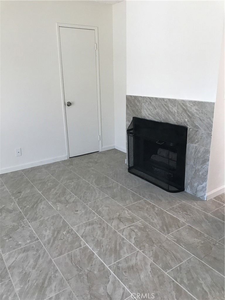 454 East Ave Q3, Unit 5 Palmdale, CA 93550 - Photo 5 of 10 a living room with a fireplace